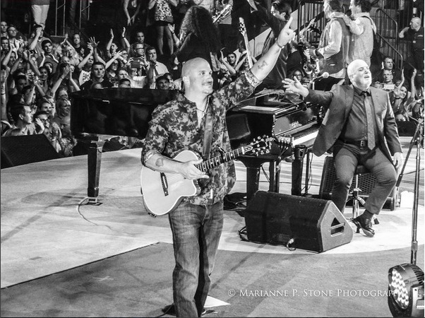 Mike Delguidice on stage with Billy Joel