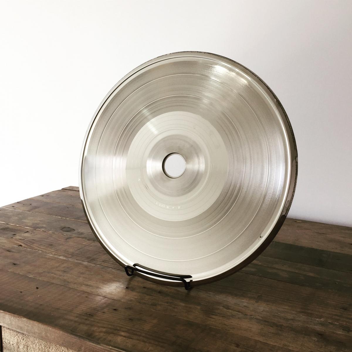 One of the metal stampers used to press the record