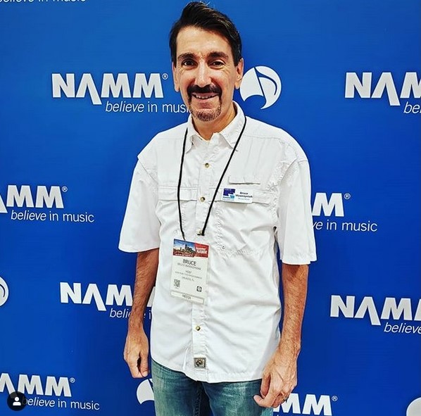 Standing by NAMM banner