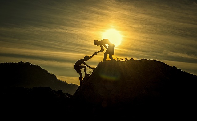 Helping hand up to mountain top