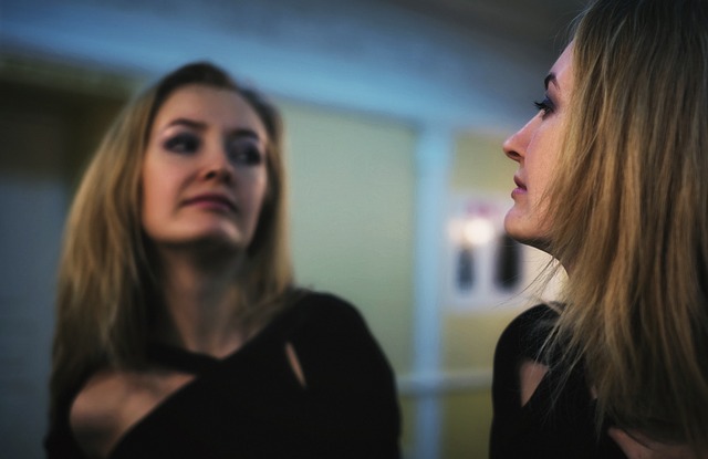 Girl looking in mirror