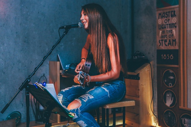 Girl singing and playing guitar