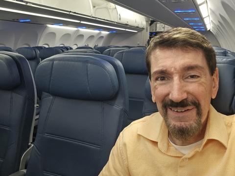 Bruce Wawrzyniak sitting in his seat on an airplane, empty at the time Bruce Wawrzyniak sitting in his seat on an airplane, empty at the time